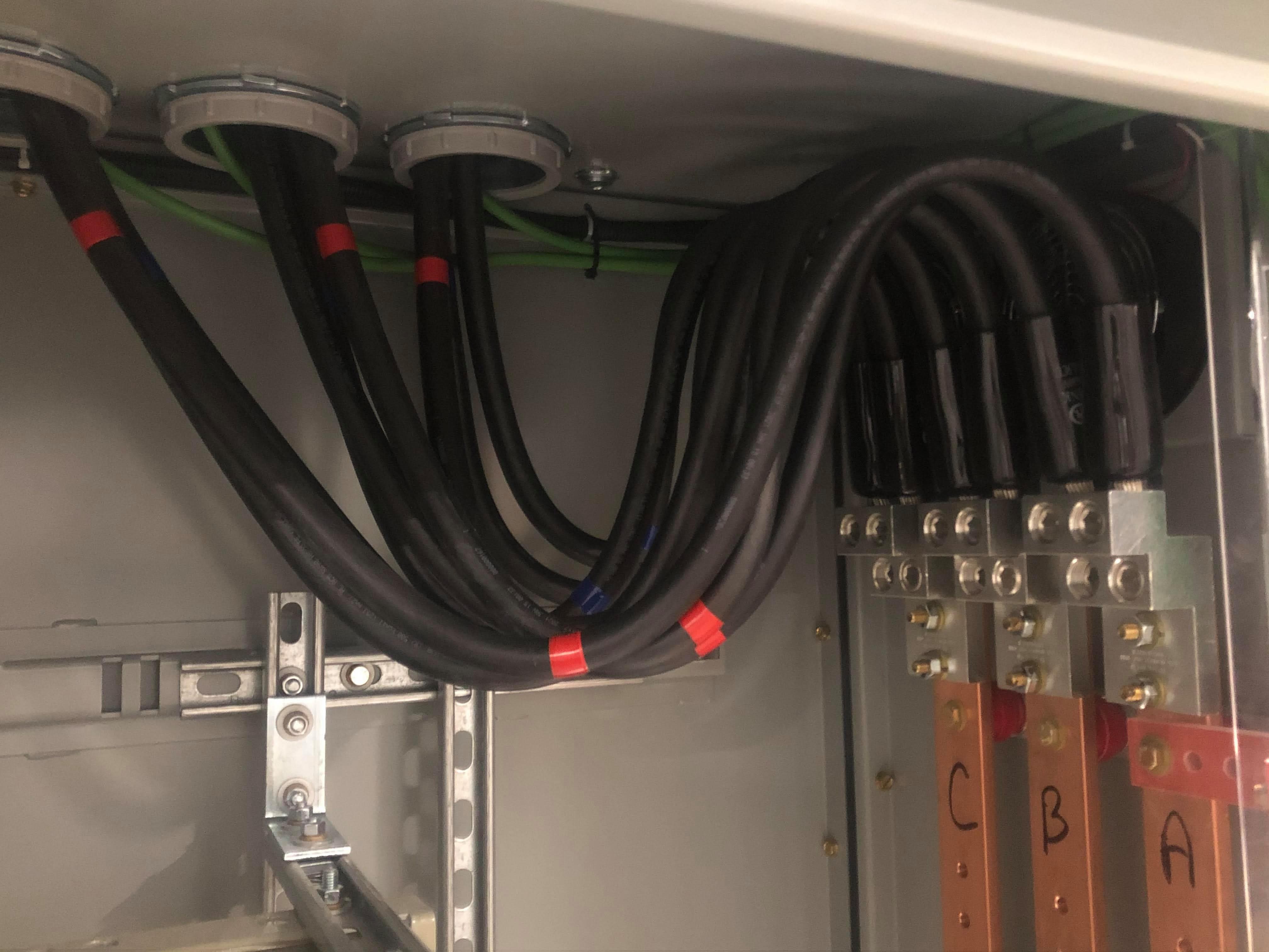 Service feeder cables terminated to a copper busbar with A, B, C labelling